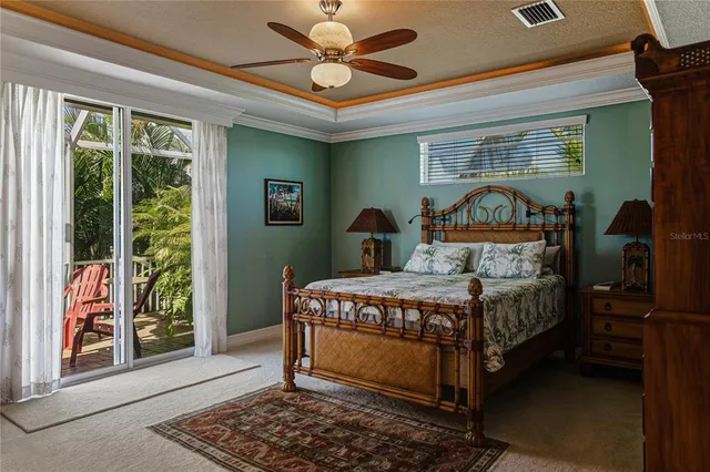 a view of a ceiling fan and table in a room