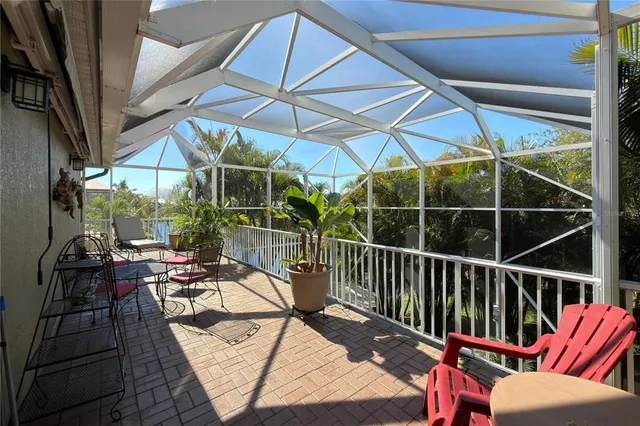 an aerial view of residential houses with outdoor space and lake view