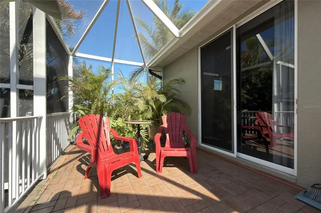 an aerial view of a house with garden space and street view