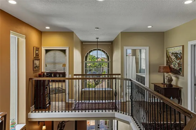 a view of a house with swimming pool and sitting area