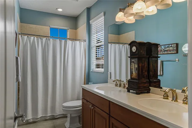 an aerial view of a house with a lake view