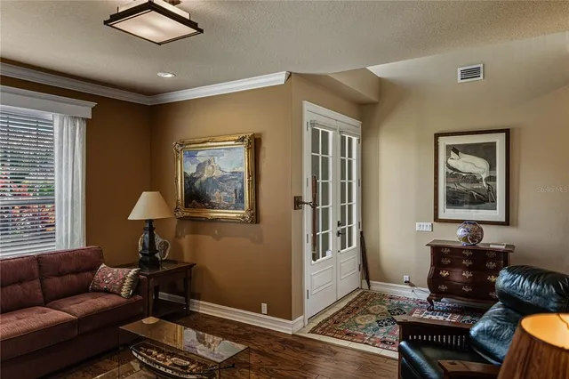 a kitchen with stainless steel appliances kitchen island granite countertop a refrigerator and a stove top oven