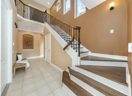 a kitchen with granite countertop a sink stainless steel appliances and cabinets