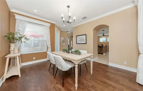 a kitchen with stainless steel appliances granite countertop a refrigerator and a stove
