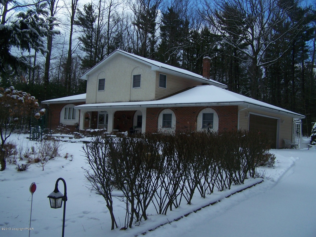 557 Long Mountain Road Effort, PA 18330 - Photo 2 of 45 a front view of house with yard and trees in the background