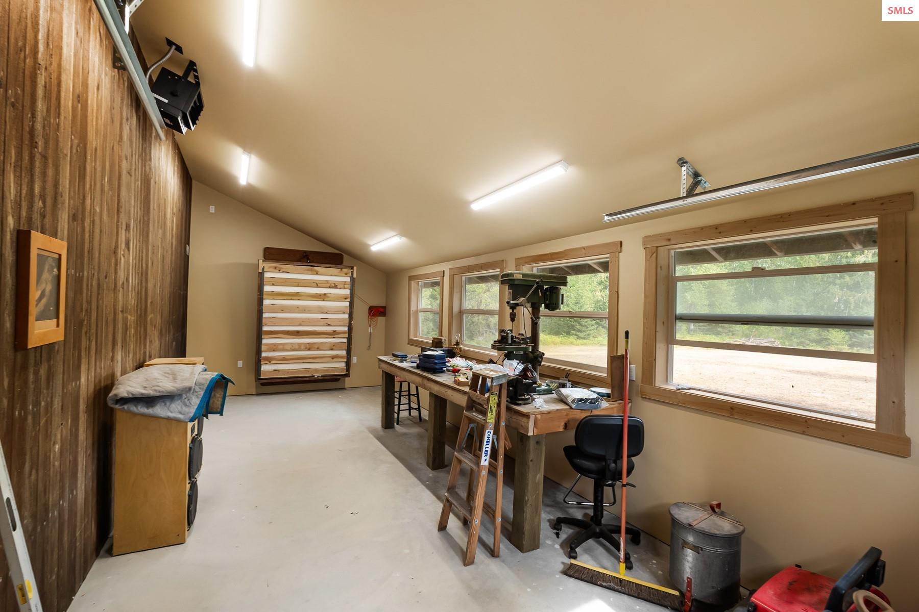 7017-7019 Colburn Culver Road Sandpoint, ID 83864 - Photo 54 of 75 Concrete Slab, large windows, power and heat - murphy bed has been added for overnight use