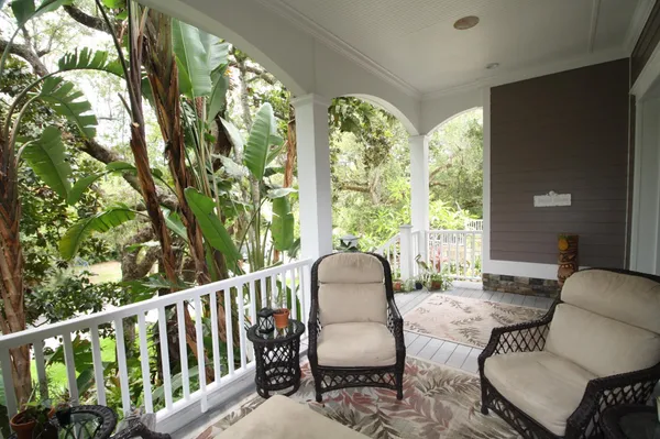 a view of a balcony with chairs