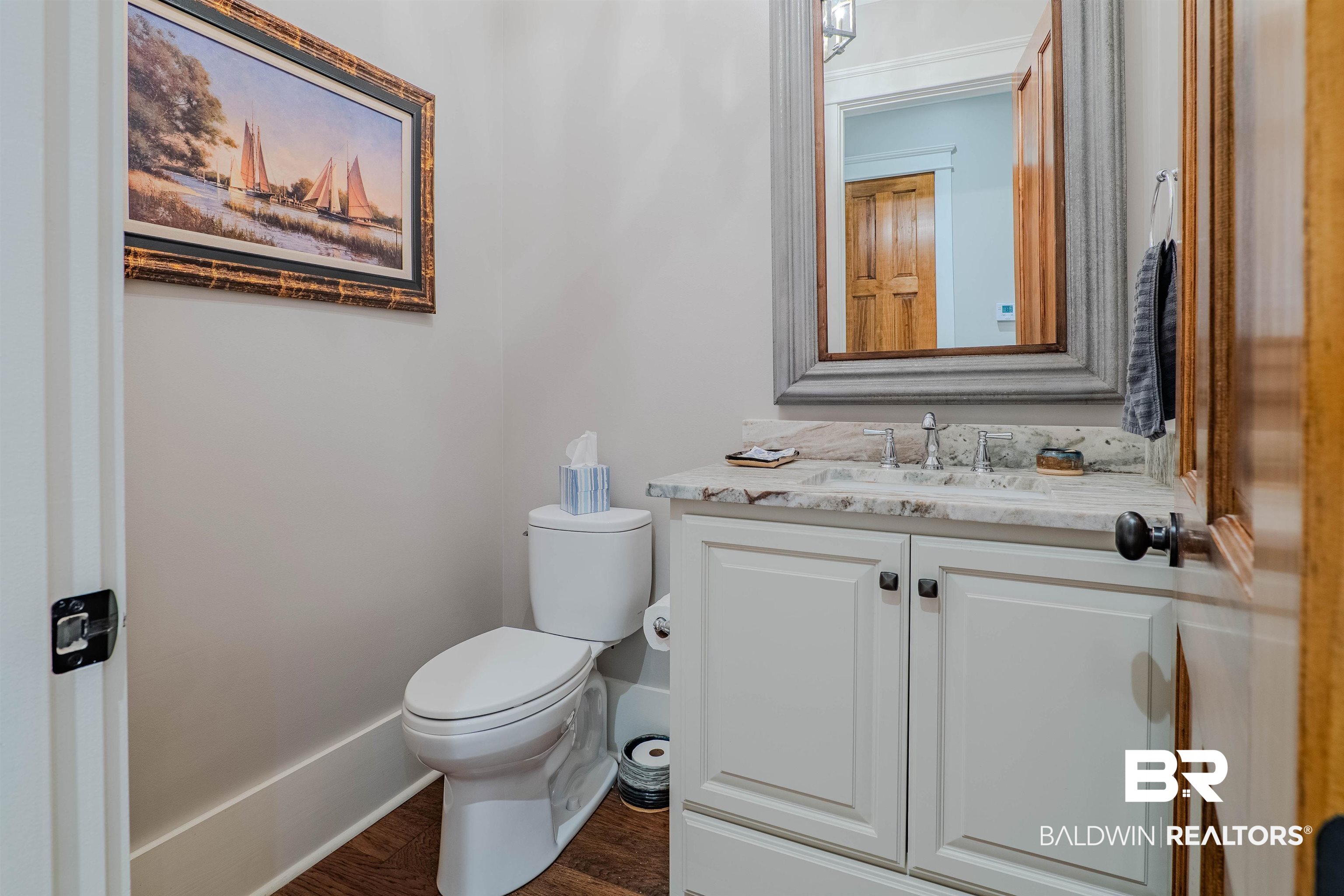 708 Manning Place Fairhope, AL 36532 - Photo 21 of 58 Bathroom featuring hardwood / wood-style flooring, vanity, and toilet