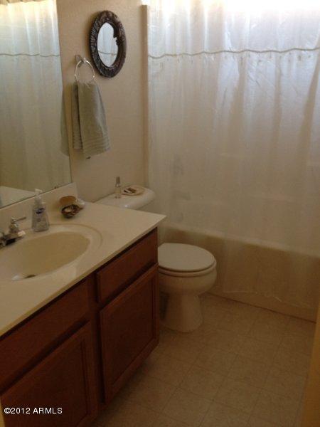 4132 East Chambers Street Phoenix, AZ 85040 - Photo 12 of 16 a bathroom with a sink and a toilet