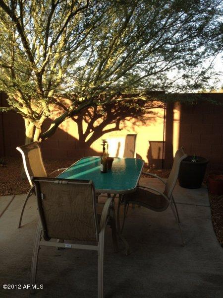 4132 East Chambers Street Phoenix, AZ 85040 - Photo 14 of 16 a backyard of a house with table and chairs