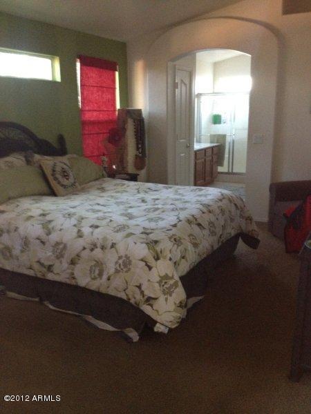 4132 East Chambers Street Phoenix, AZ 85040 - Photo 9 of 16 a bedroom with bed and window