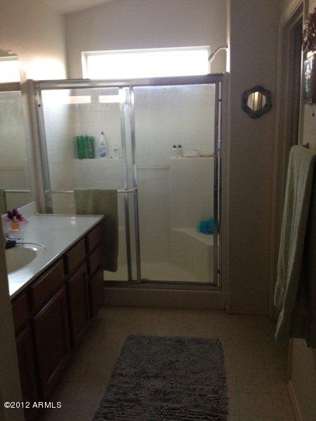 4132 East Chambers Street Phoenix, AZ 85040 - Photo 10 of 16 a bathroom with a shower and a sink
