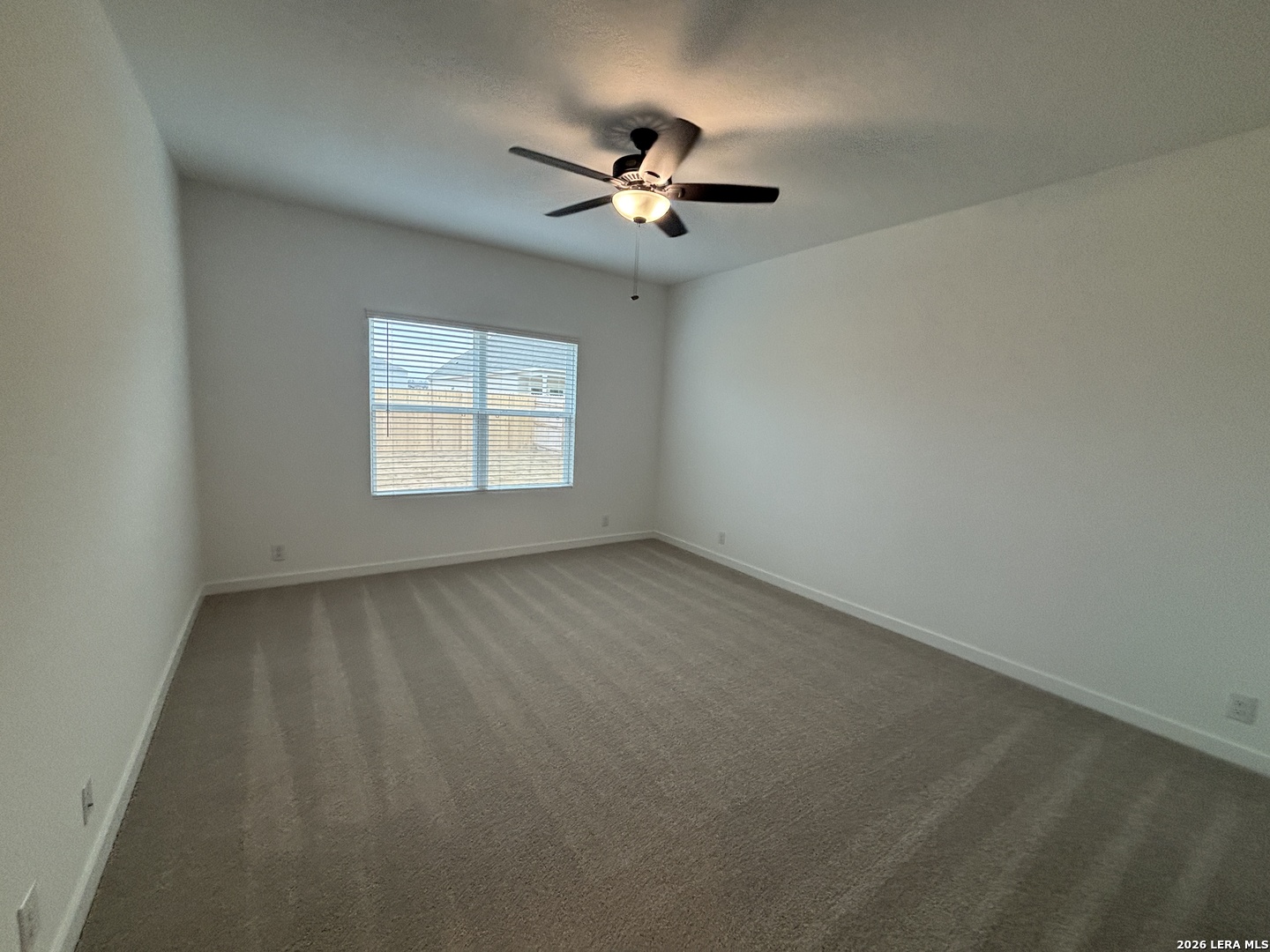 10101 Peppercorn Place Schertz, TX 78154 - Photo 15 of 36 wooden floor in an empty room with a window