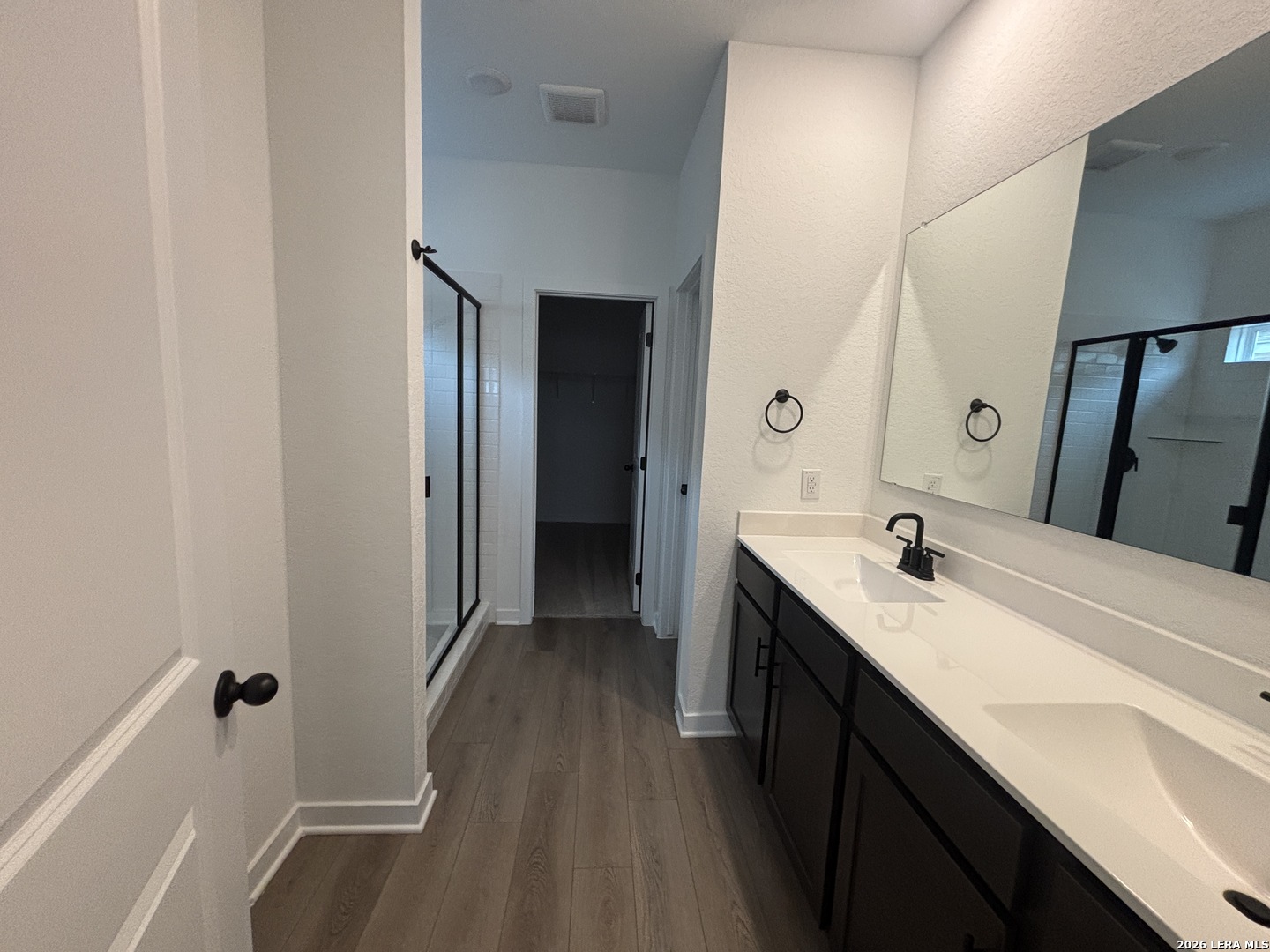 10101 Peppercorn Place Schertz, TX 78154 - Photo 16 of 36 a en suite bathroom with a double vanity sink and a mirror