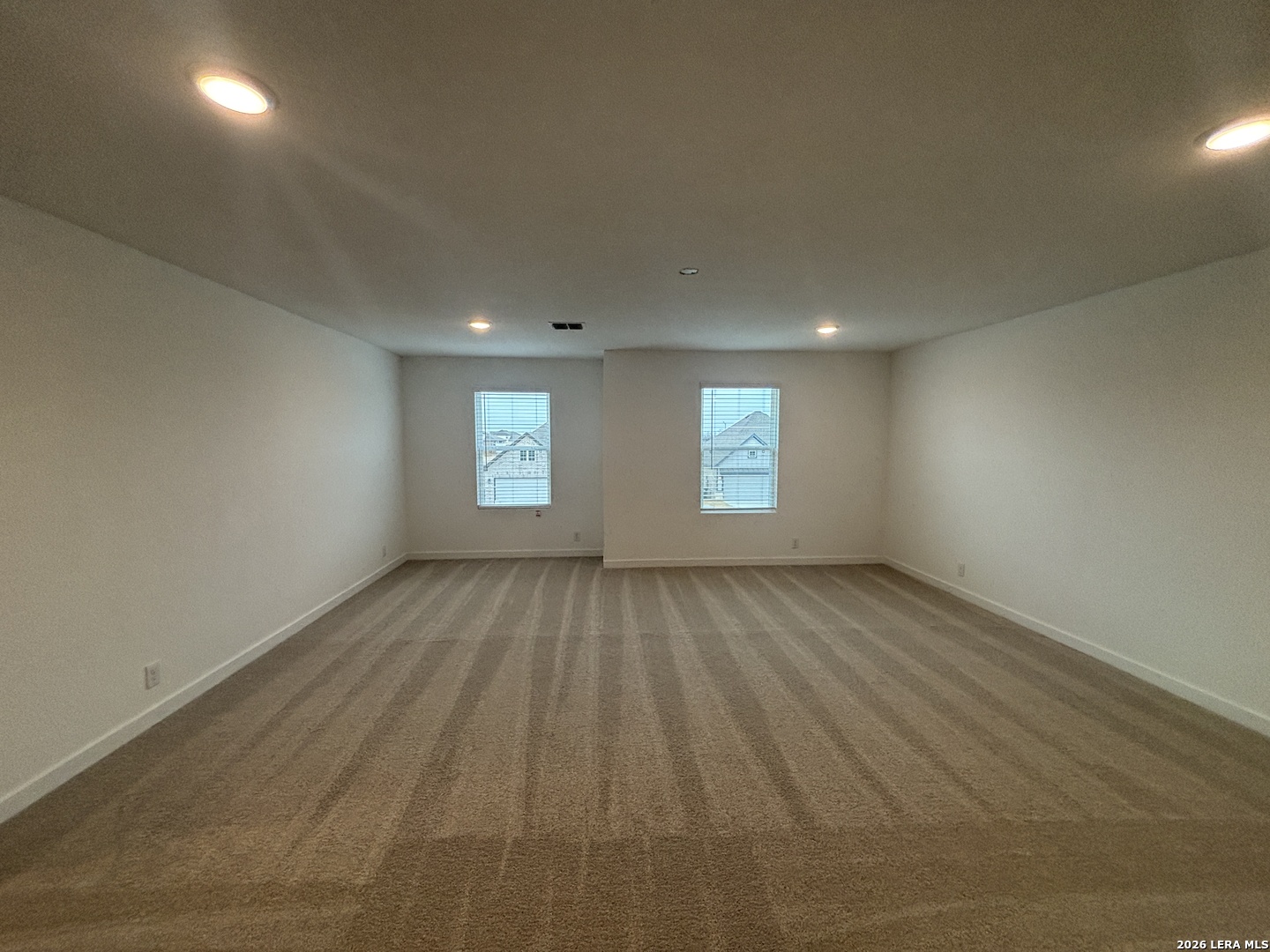 10101 Peppercorn Place Schertz, TX 78154 - Photo 20 of 36 an empty room with windows
