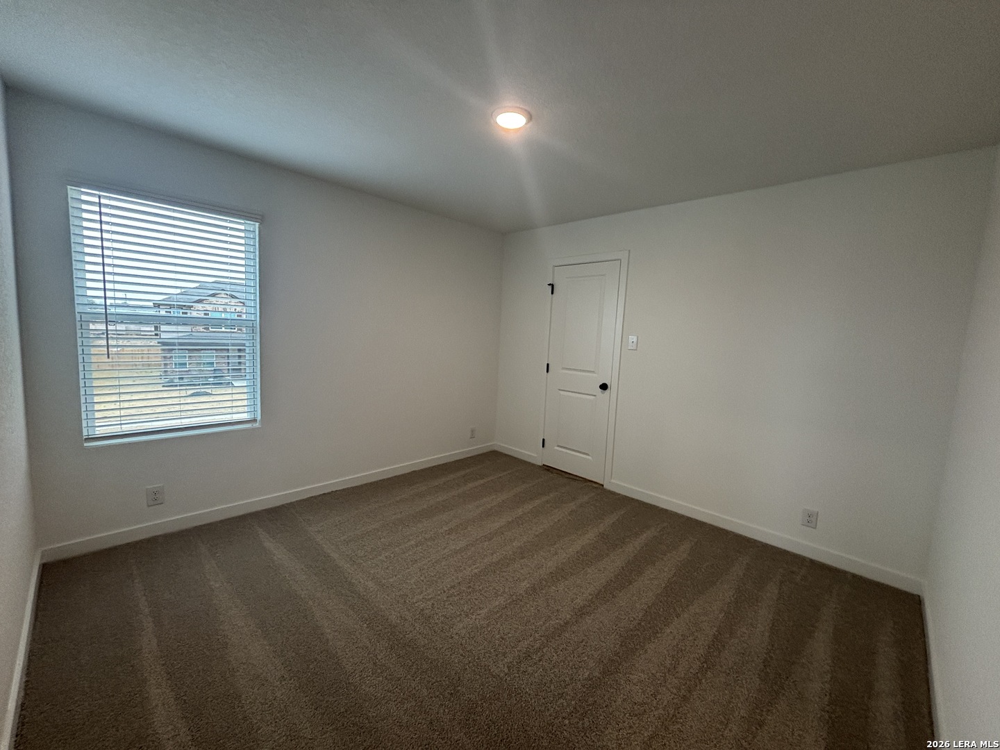 10101 Peppercorn Place Schertz, TX 78154 - Photo 22 of 36 an empty room with a window