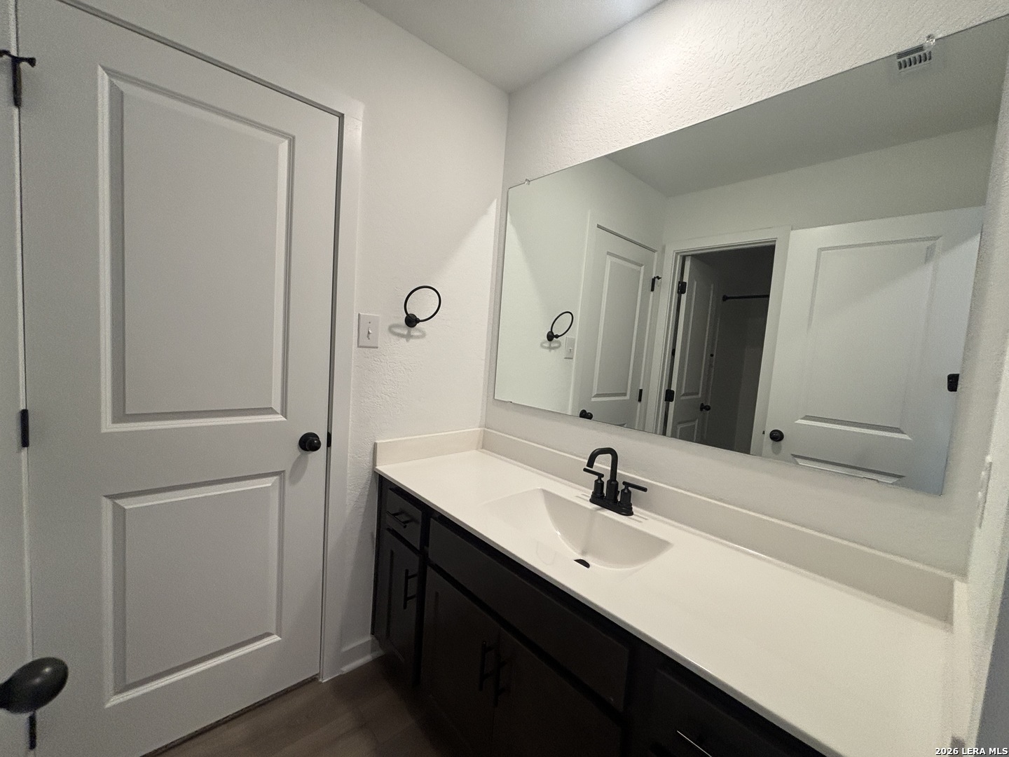 10101 Peppercorn Place Schertz, TX 78154 - Photo 23 of 36 a bathroom with a sink and a mirror