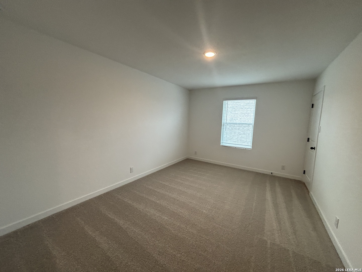10101 Peppercorn Place Schertz, TX 78154 - Photo 25 of 36 an empty room with a window