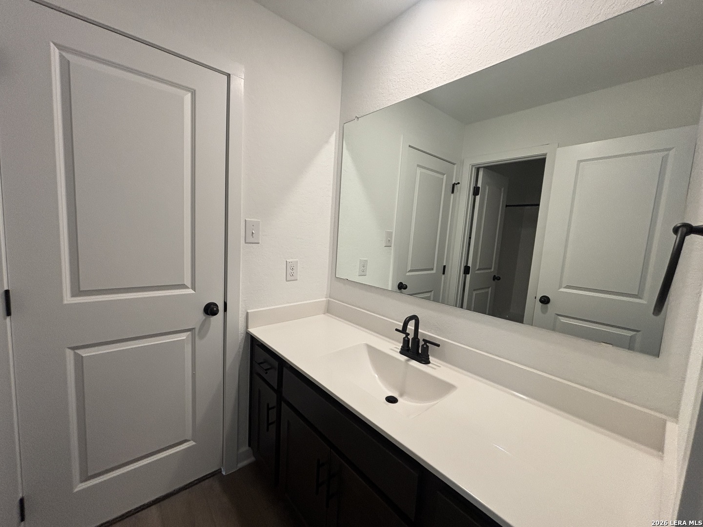 10101 Peppercorn Place Schertz, TX 78154 - Photo 26 of 36 a bathroom with a sink and a mirror
