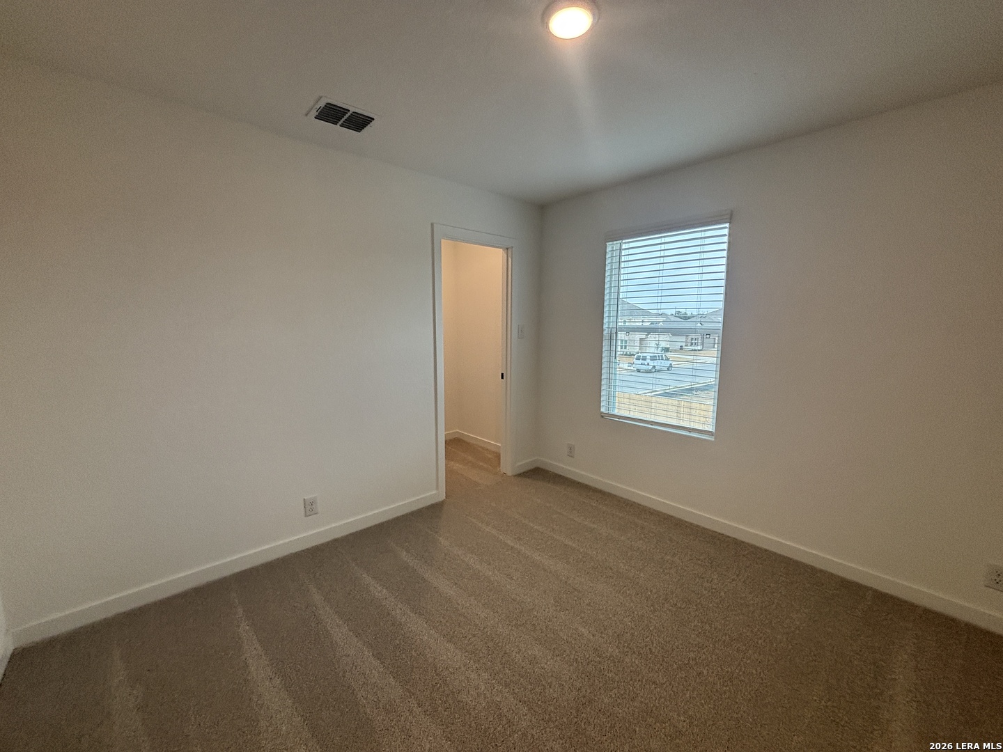 10101 Peppercorn Place Schertz, TX 78154 - Photo 27 of 36 an empty room with windows