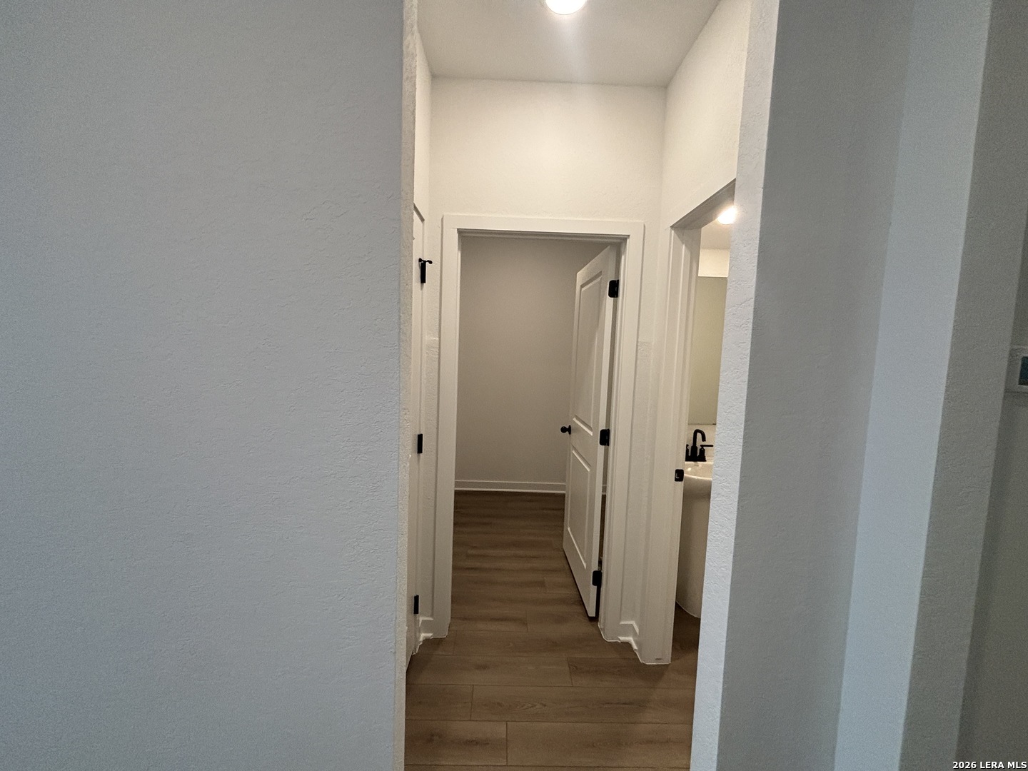 10101 Peppercorn Place Schertz, TX 78154 - Photo 29 of 36 a view of a hallway with wooden floor