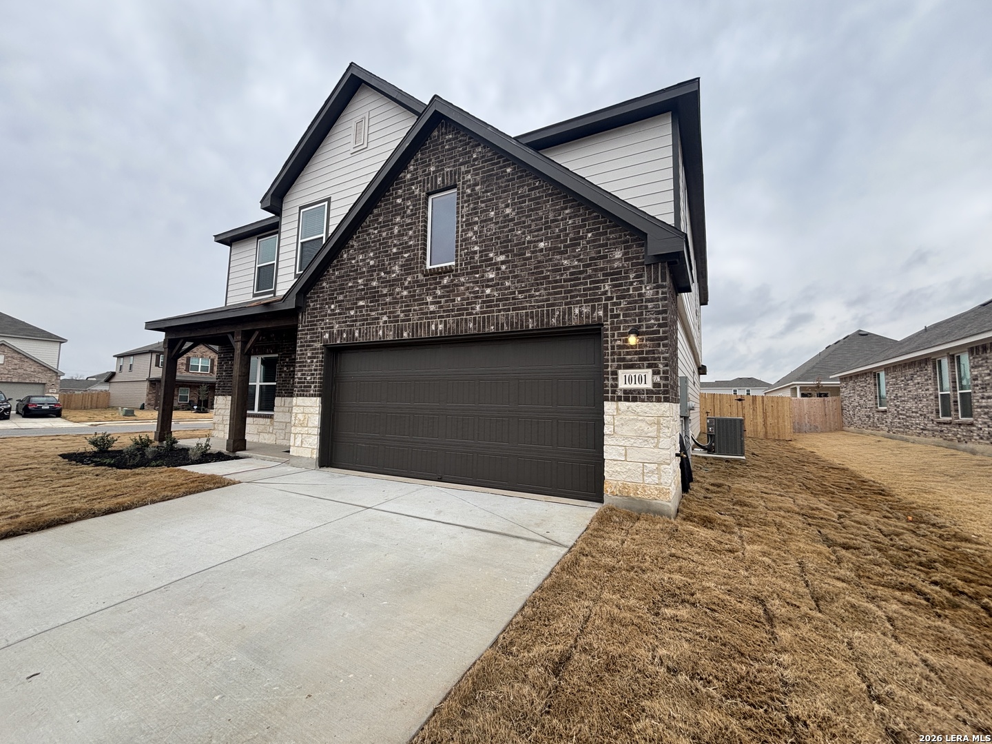 10101 Peppercorn Place Schertz, TX 78154 - Photo 4 of 36 a front view of a house with a yard and garage