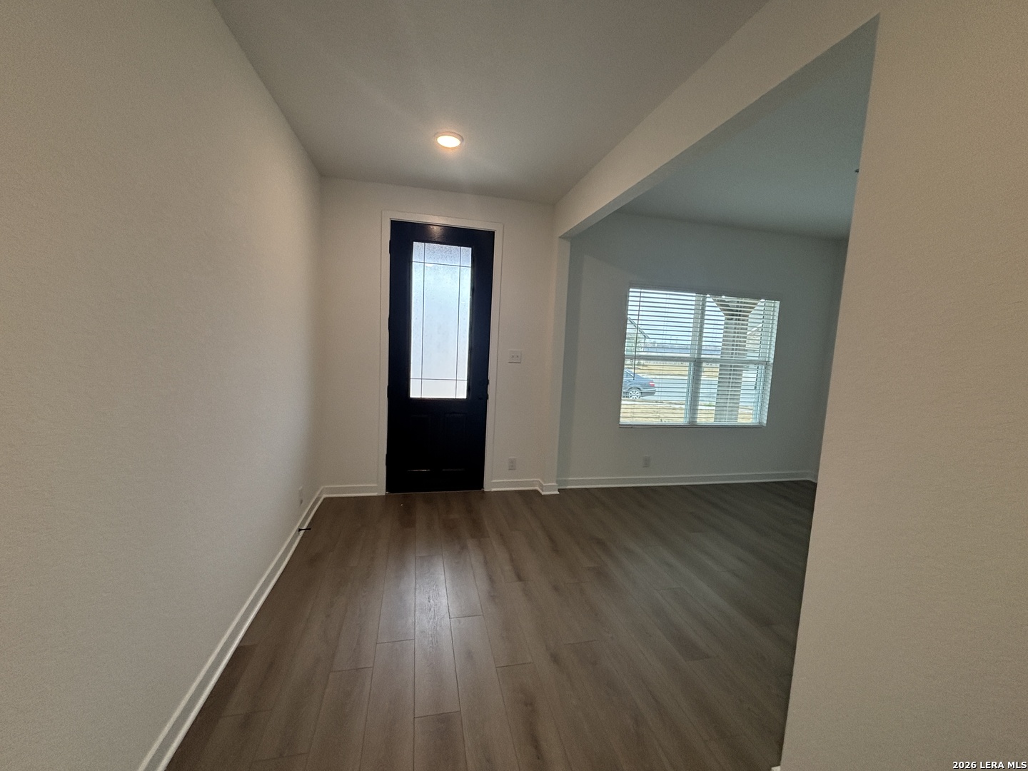 10101 Peppercorn Place Schertz, TX 78154 - Photo 9 of 36 an empty room with wooden floor and windows