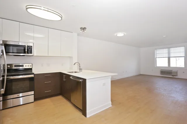 a view of a kitchen with a sink cabinets and a window