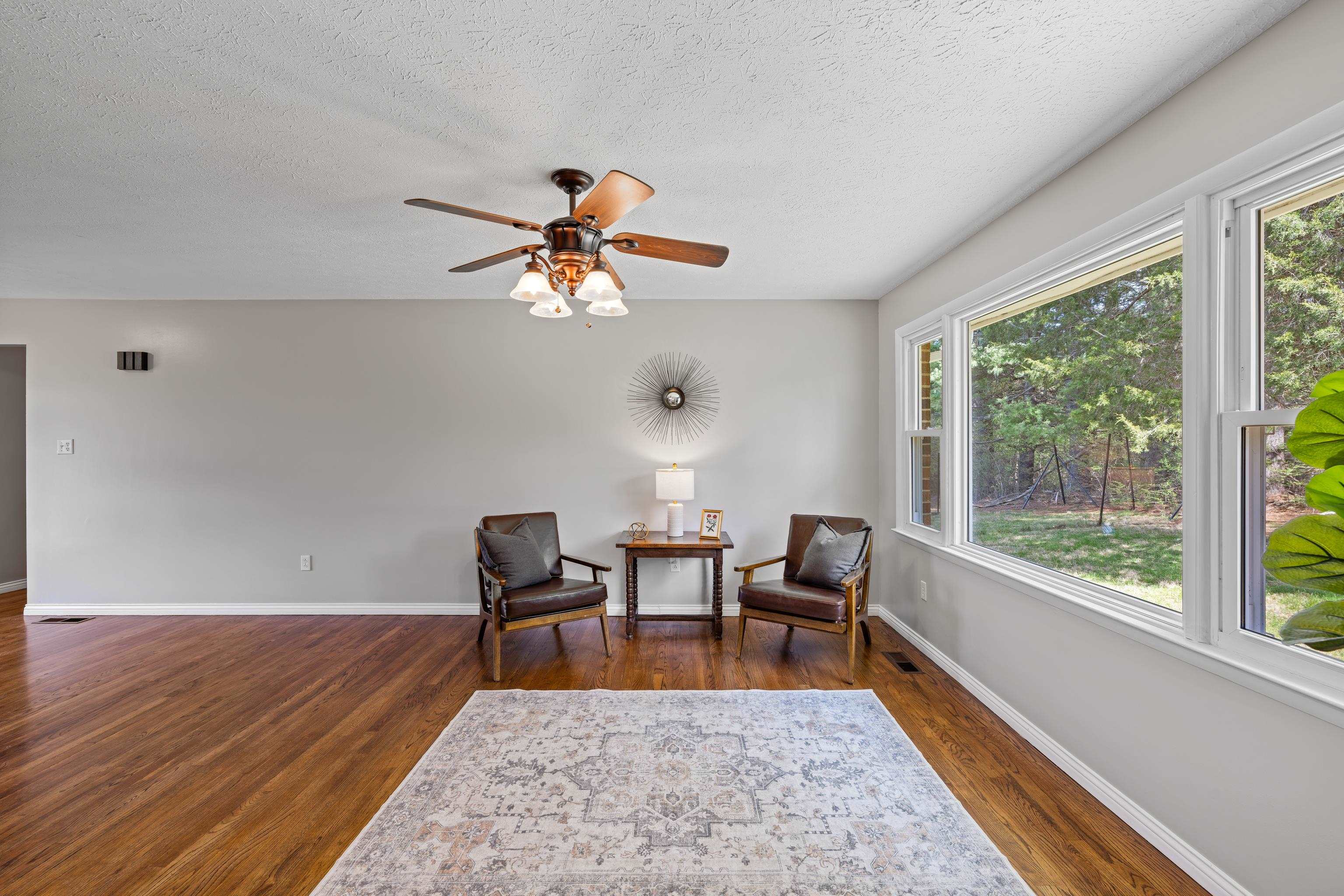 249 Cattle Scales Road Waynesboro, VA 22980 - Photo 12 of 50 a view of a dining room with furniture window and wooden floor