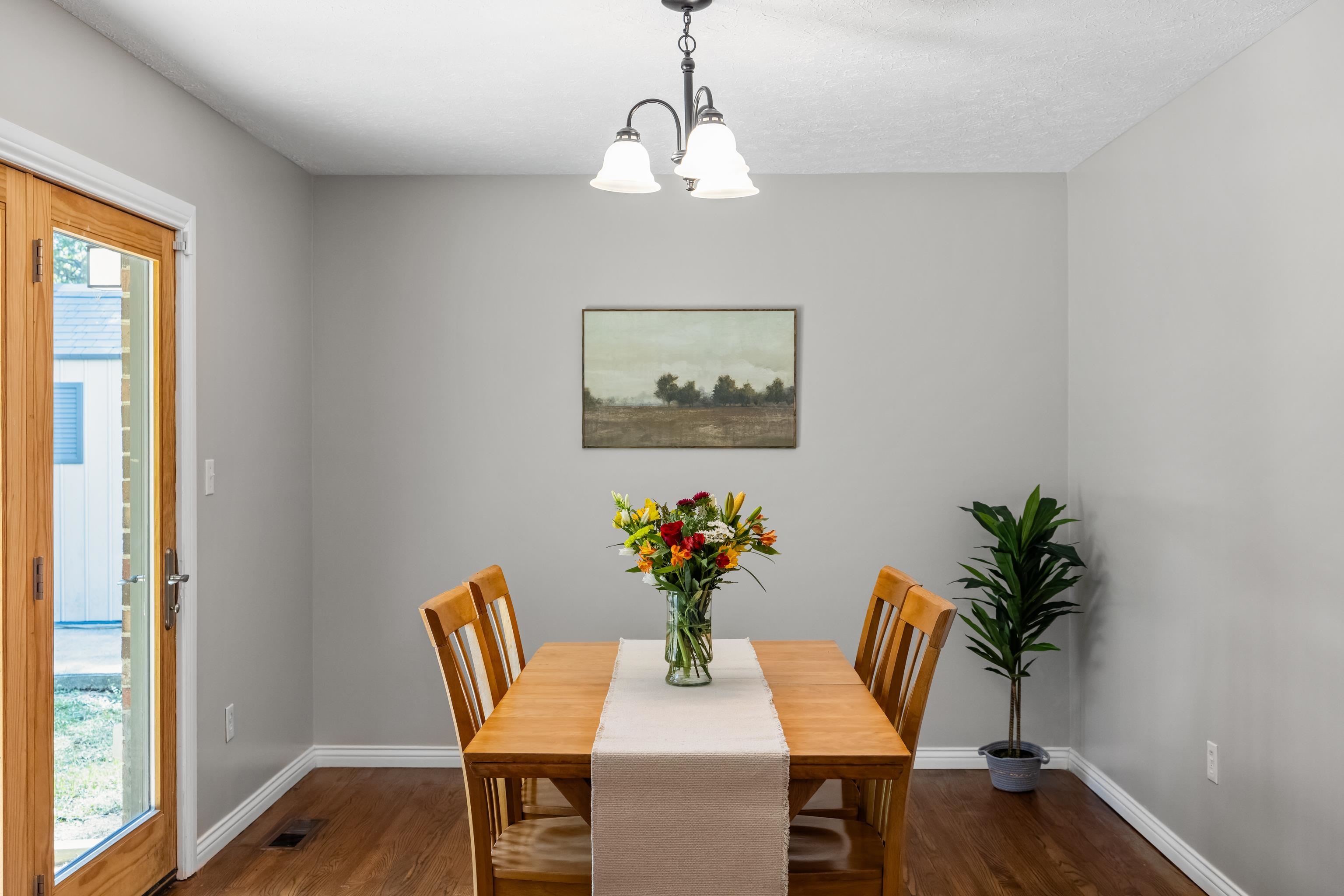 249 Cattle Scales Road Waynesboro, VA 22980 - Photo 14 of 50 a dining room with furniture potted plants and wooden floor