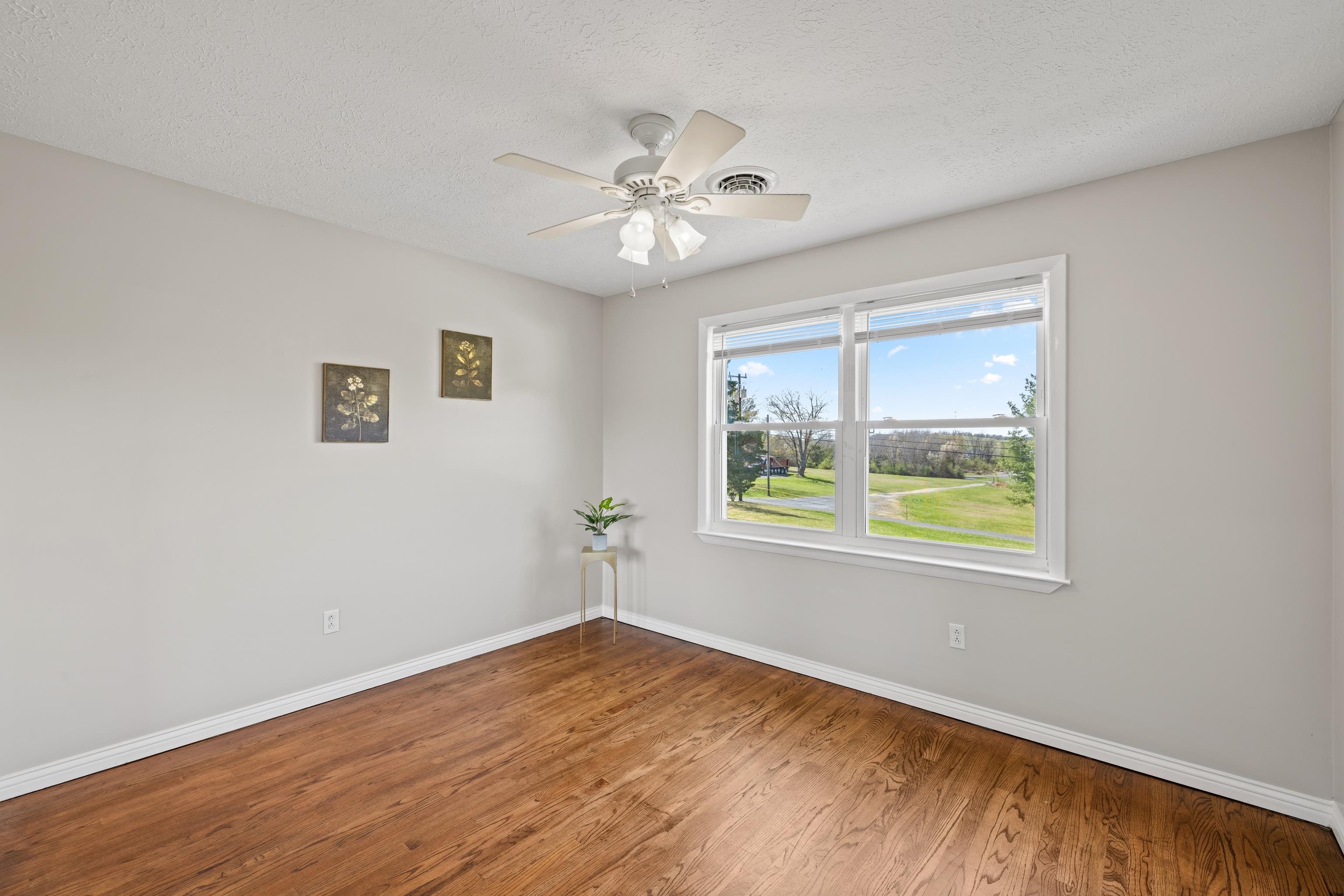 249 Cattle Scales Road Waynesboro, VA 22980 - Photo 33 of 50 a view of an empty room with wooden floor and a window