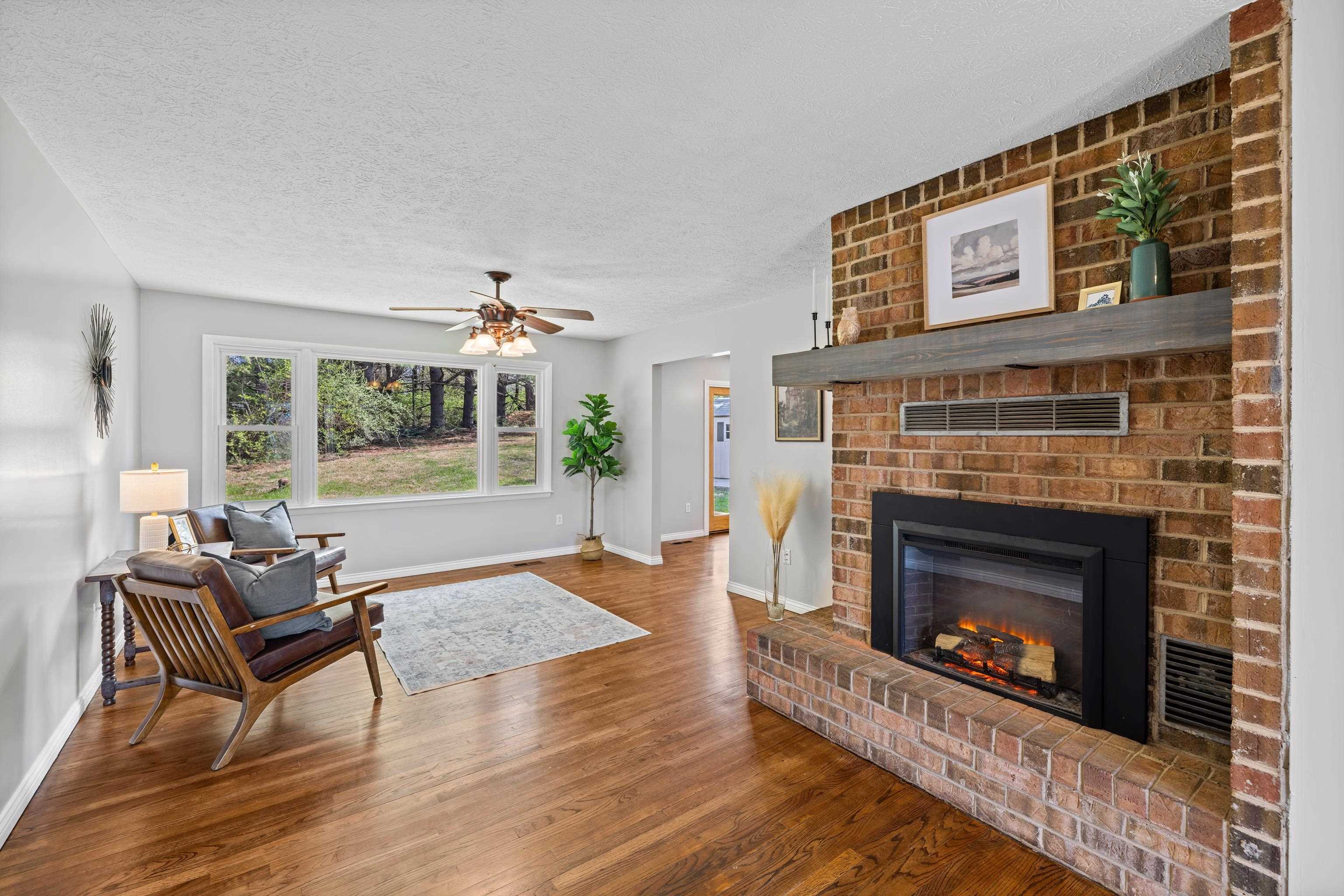 249 Cattle Scales Road Waynesboro, VA 22980 - Photo 8 of 50 a living room with furniture and a fireplace