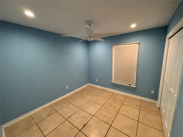 a view of a livingroom with furniture and a window