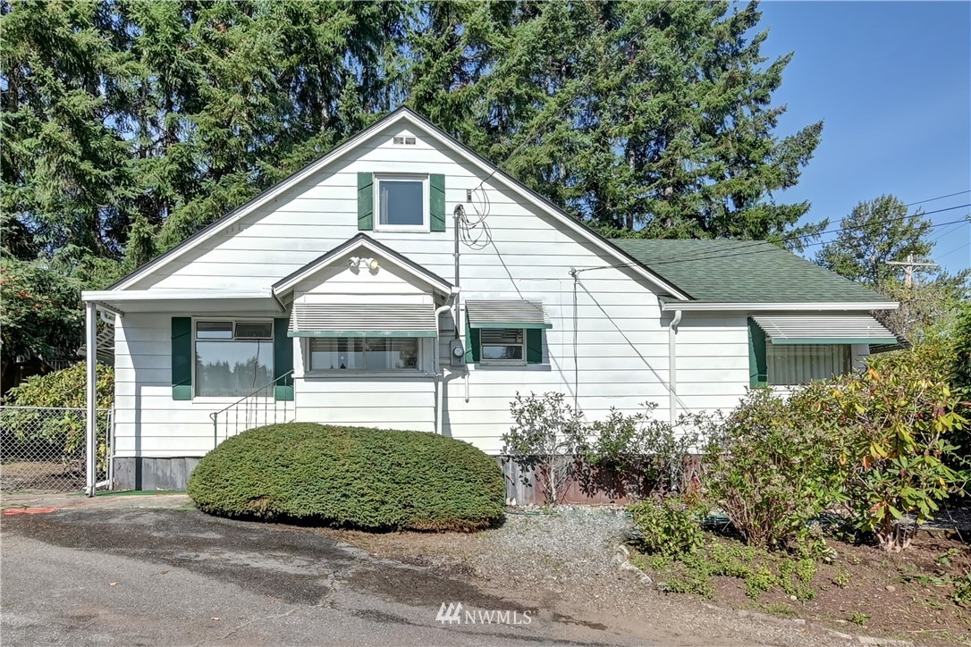 19722 13th Drive Southeast Bothell, WA 98012 - Photo 1 of 21 a front view of a house with a garden