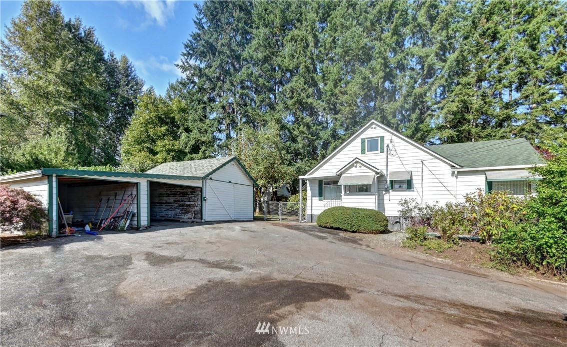 19722 13th Drive Southeast Bothell, WA 98012 - Photo 3 of 21 a front view of a house with yard and garage