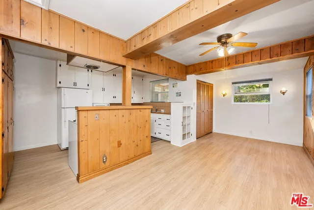 a view of a kitchen with wooden floor