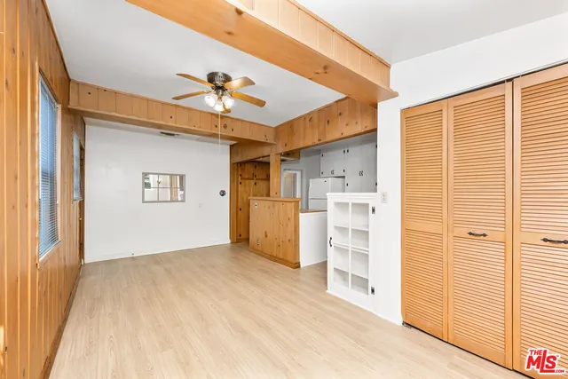 a view of a kitchen with a sink and a cabinet