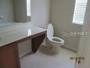 a bathroom with a toilet and a sink