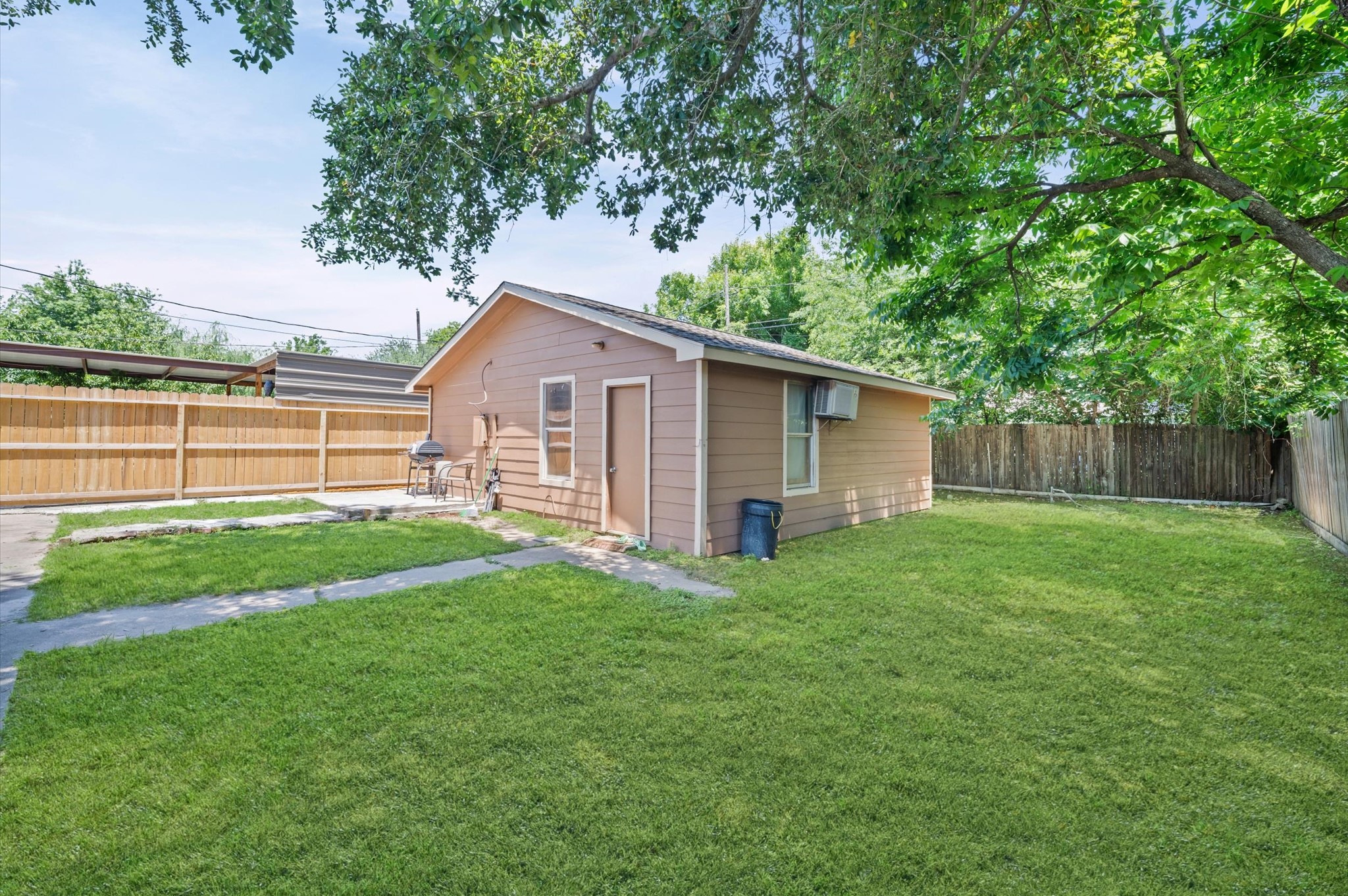 10621 Lane Street Houston, TX 77029 - Photo 21 of 29 a view of a backyard with a garden and plants