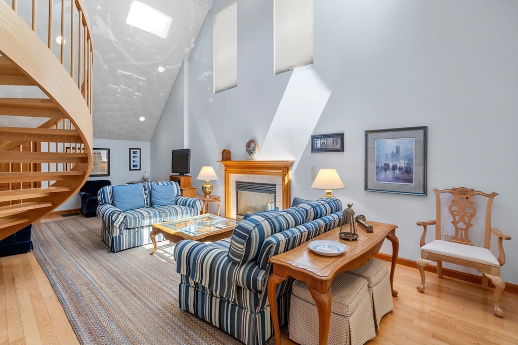 46 Deer Path, Unit 46 Hudson, MA 01749 - Photo 4 of 23 a living room with furniture and wooden floor