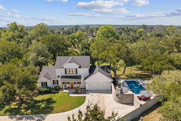 an aerial view of a house with a garden