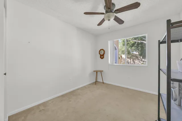 a bed room with a bed and a chandelier