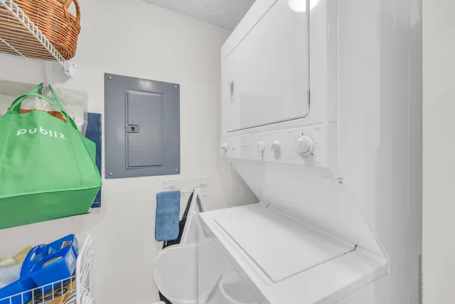 a view of a house with a yard and furniture