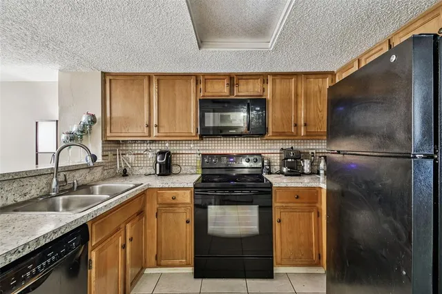 a view of a bedroom with wooden floor and furniture