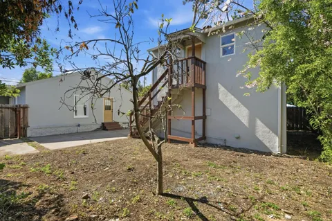 a backyard of a house with lots of green space