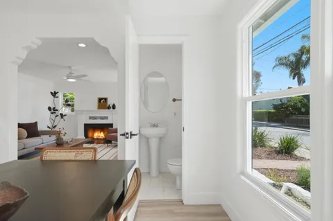 a view of kitchen with furniture and wooden floor