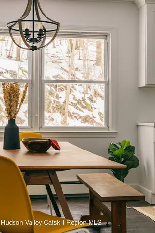 a view of a dining room with furniture window and outside view