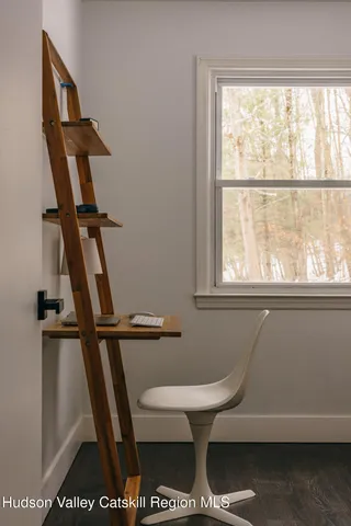 a bathroom with a toilet a sink and a window
