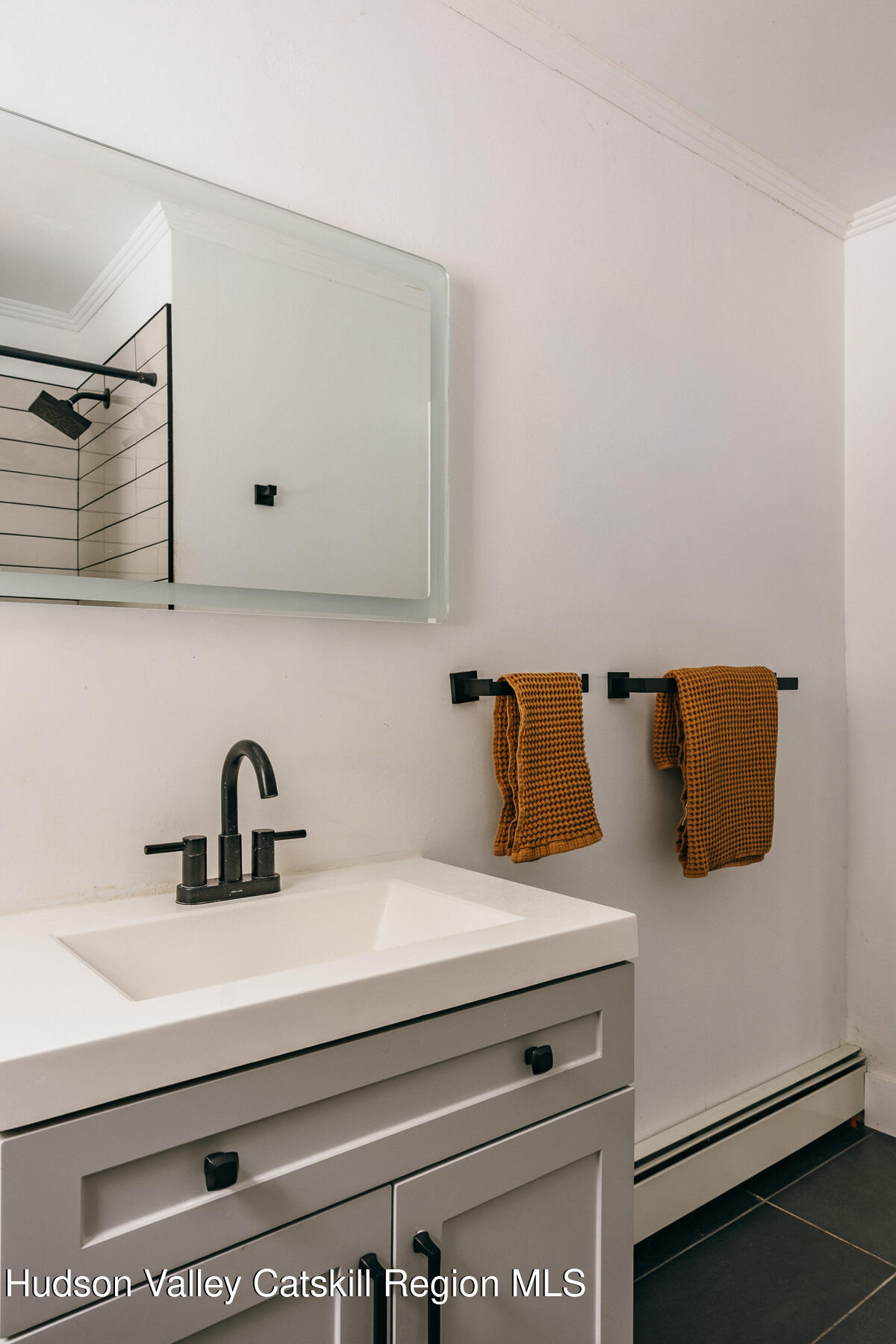 354 Slate Quarry Road Rhinebeck, NY 12572 - Photo 20 of 33 a bathroom with a sink and a mirror