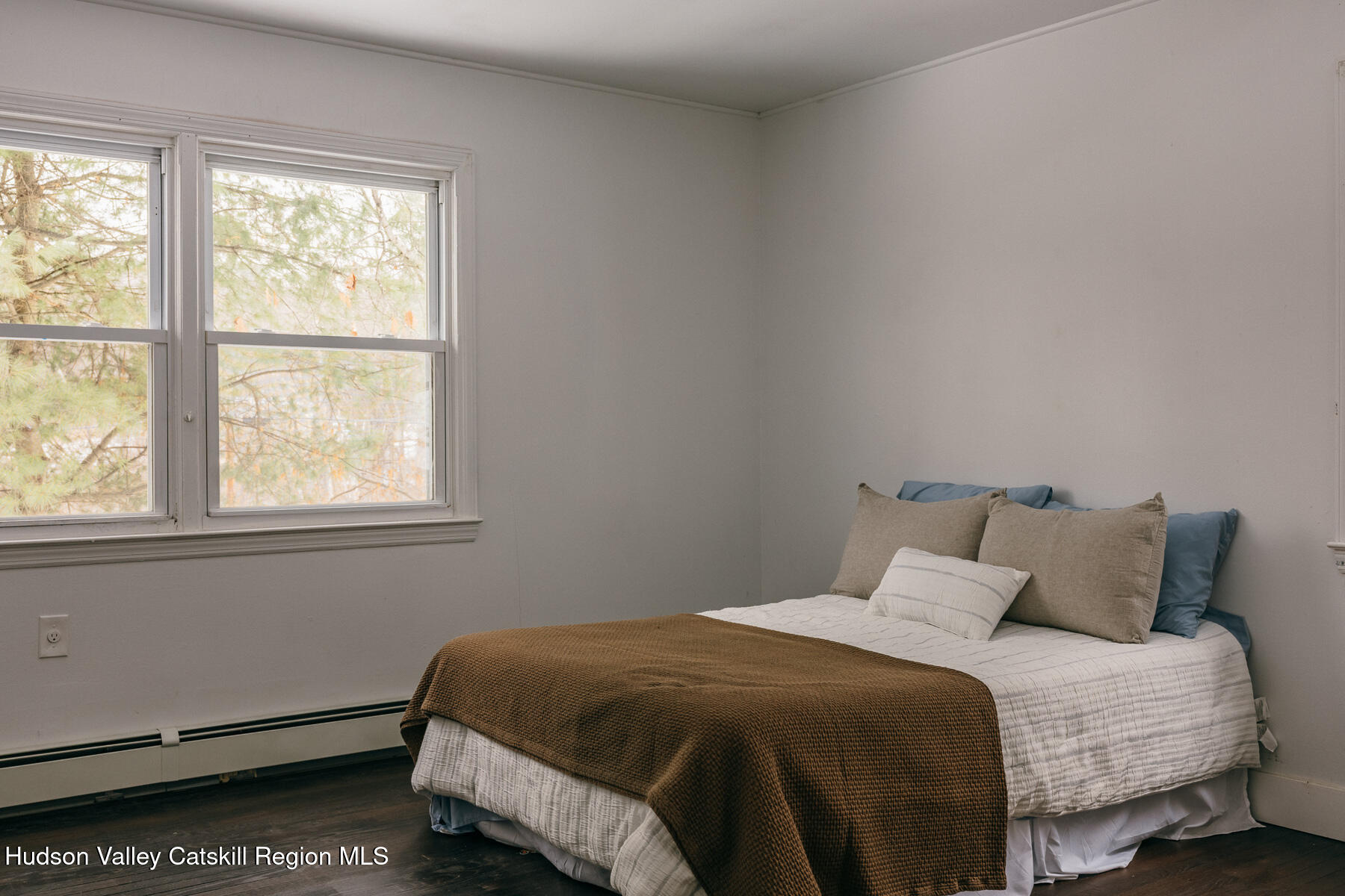 354 Slate Quarry Road Rhinebeck, NY 12572 - Photo 21 of 33 a bedroom with a bed and window